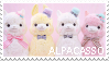 Stamp of four alpaca plushies